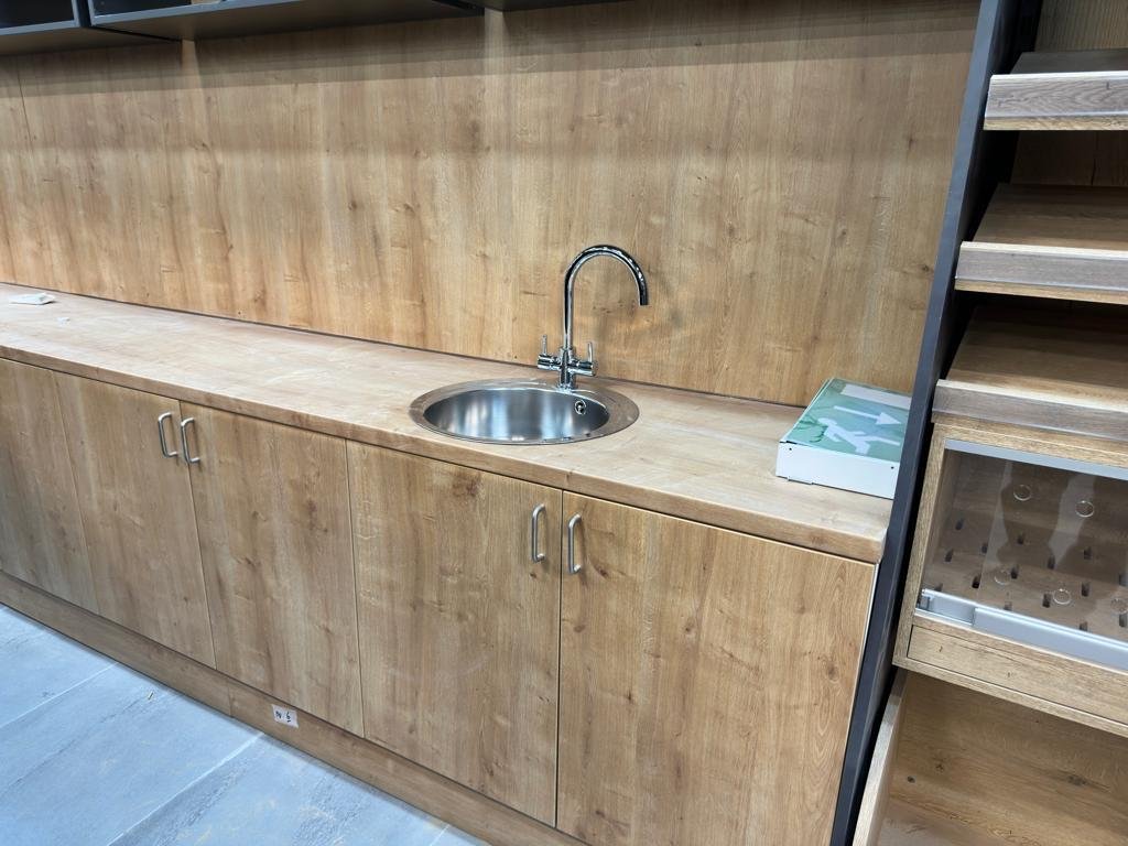 Custom wooden back counter with stainless steel sink behind a butchery display – wooden joinery by DLG Shopfitting