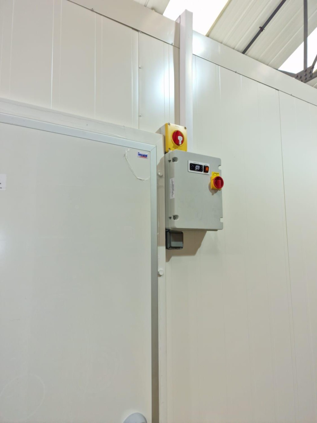 Cold room door with refrigeration control panel and emergency stop – cold room installation by DLG Shopfitting